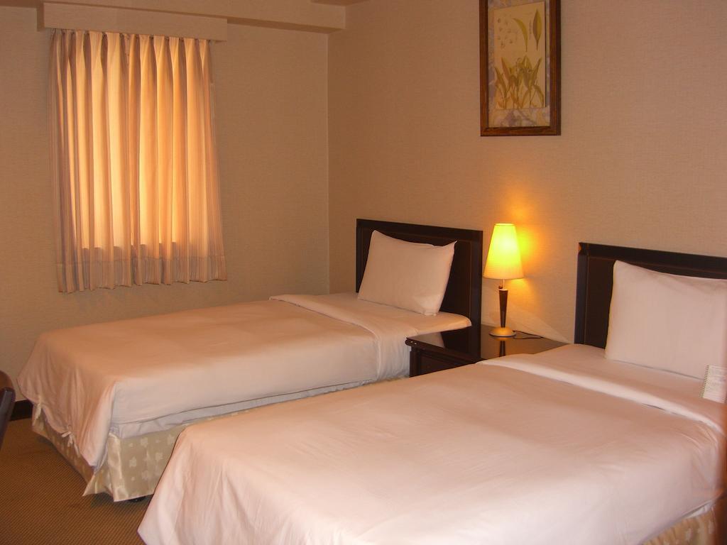 Lincoln Hotel Tainan Værelse billede